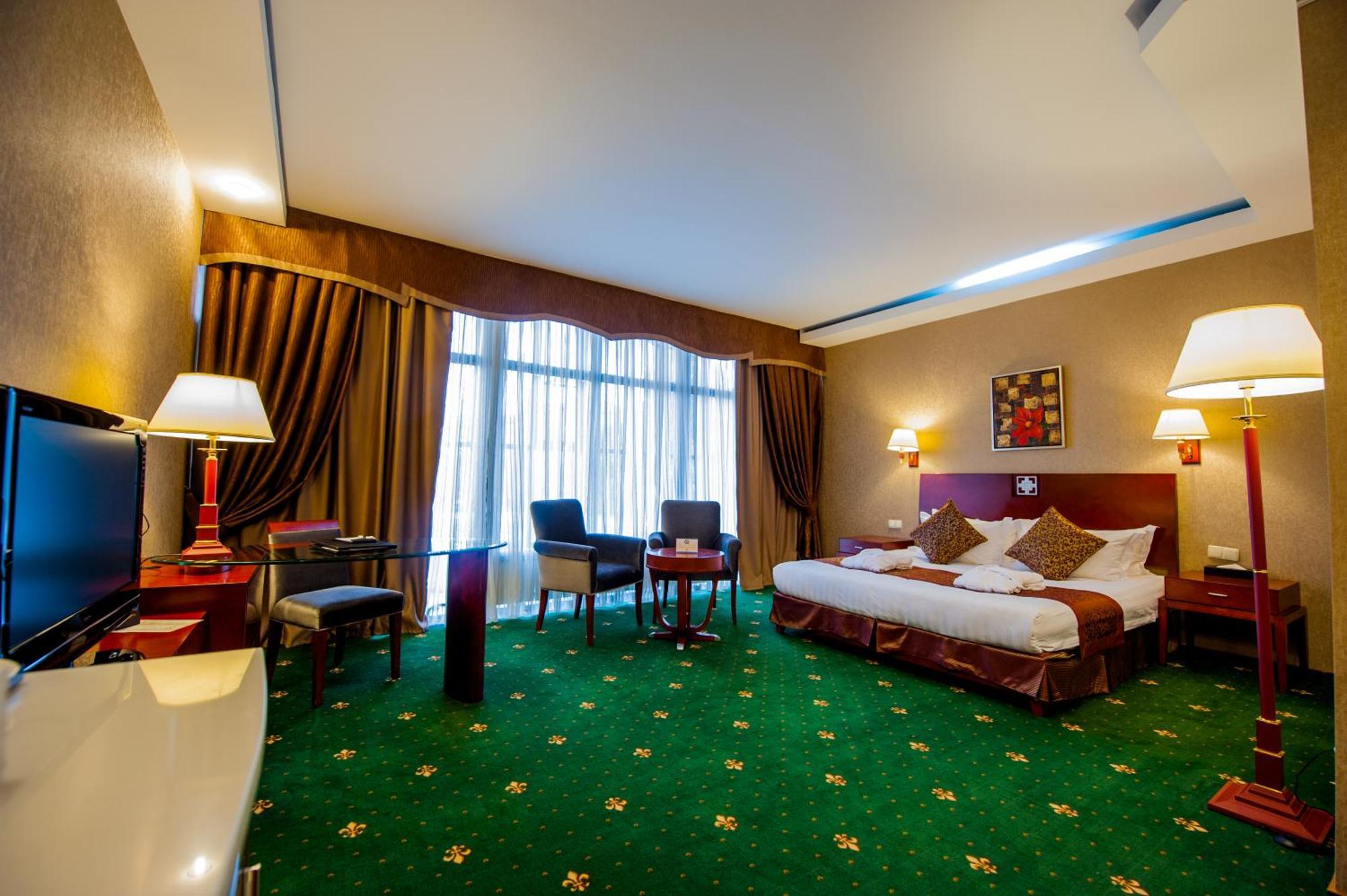 Hotel Goldman Empire Astaná Habitación foto